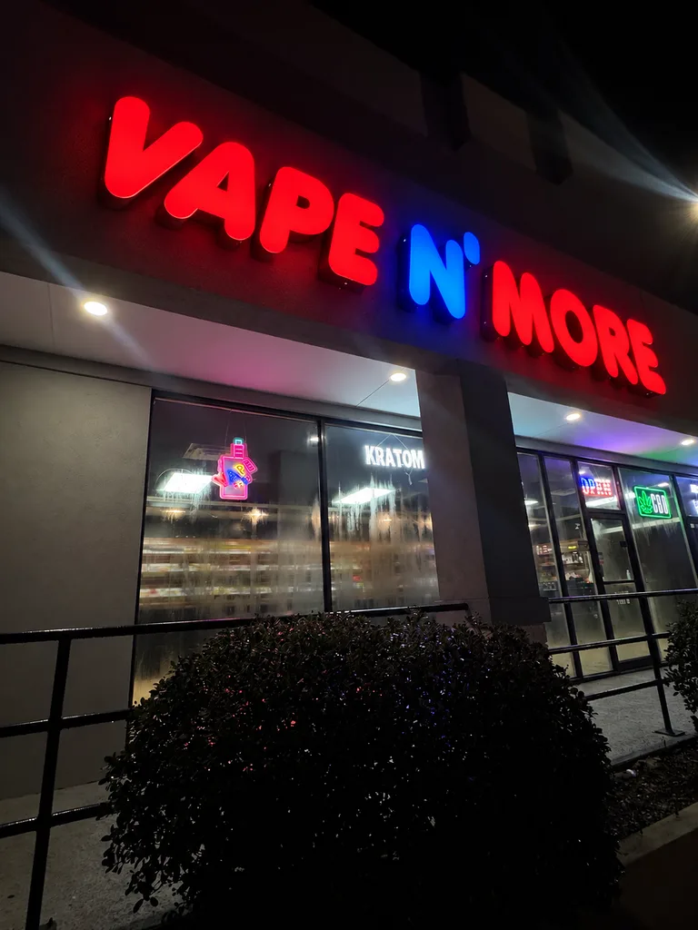 Vape N More sign lit up at night